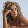 Curly Hair Care - Blonde Girl with Curly Hair