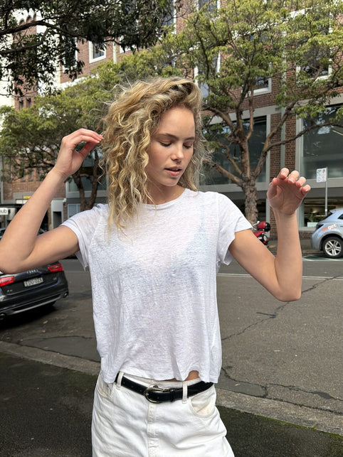Balayage curly hair with natural blonde dimension by QUE Colour Sydney