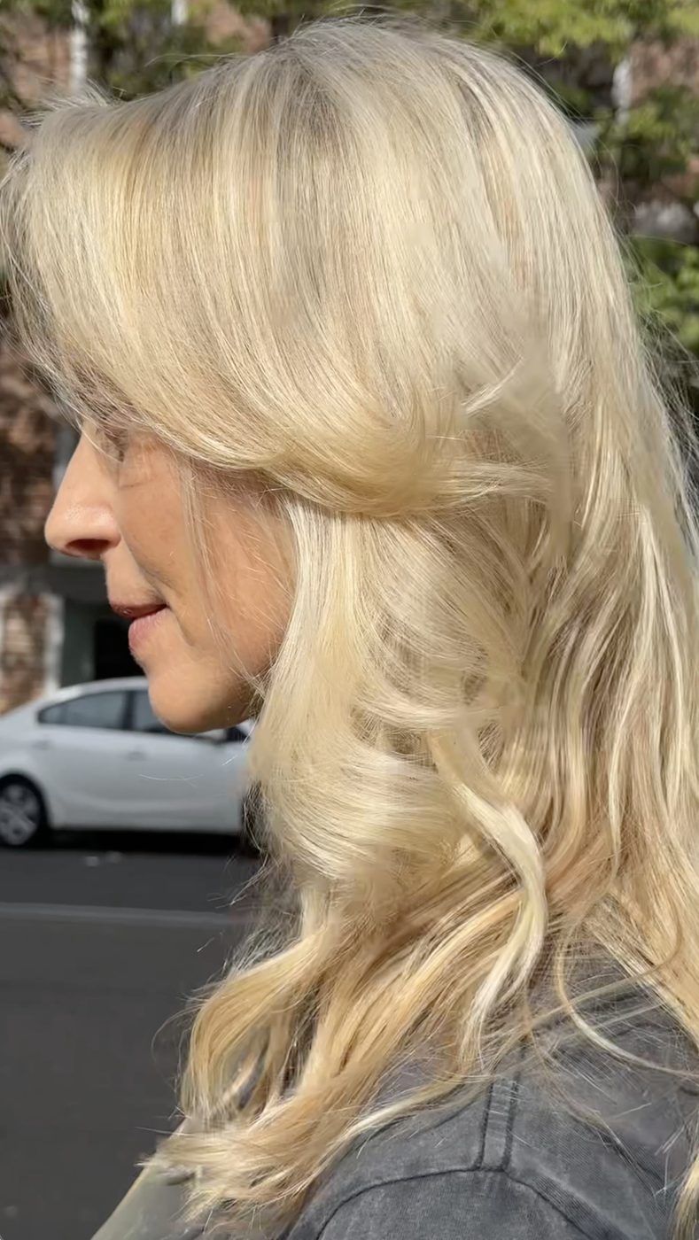 Side view of blended grey hair with soft lowlights and dimension, QUE Colour Sydney